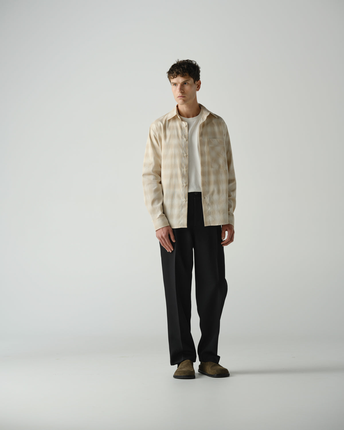 Male model in beige and check long sleeve shirt